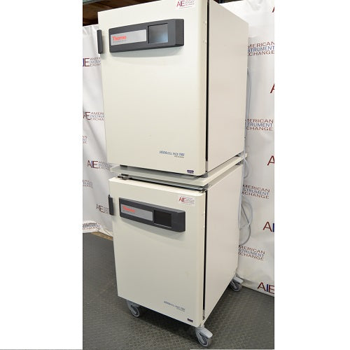 Right angled perspective view of a stacked pair of Thermo Heracell VIOS 160i CO₂ incubators on a rolling stand with closed doors showing touch display panels