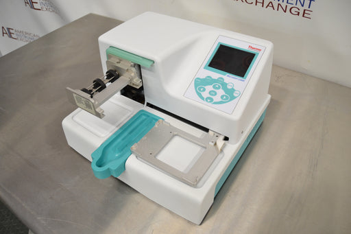 Left three-quarter angle product view of a Thermo Multidrop Combi reagent dispenser, highlighting its white housing, digital display keypad, and automated dispensing cassette setup
