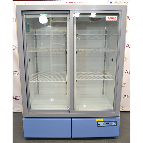 Thermo Revco REC4504A chromatography refrigerator ka front view, jisme double glass sliding doors, adjustable wire shelves, aur bottom-mounted control panel saaf dikhai de rahe hain.   