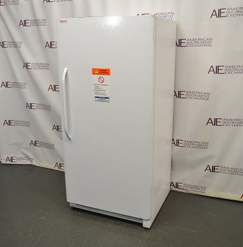Right angled perspective view of white Thermo Scientific 20LREETSA laboratory refrigerator with closed door showing front warning label