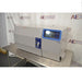 Right angled perspective view of a Thermo Scientific CryoMed controlled rate freezer resting on a stainless steel surface showcasing its digital control panel and main chamber housing