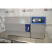 Front eye-level view of a Thermo Scientific CryoMed controlled rate freezer resting on a stainless steel surface featuring a front-loading door and digital touchscreen control panel
