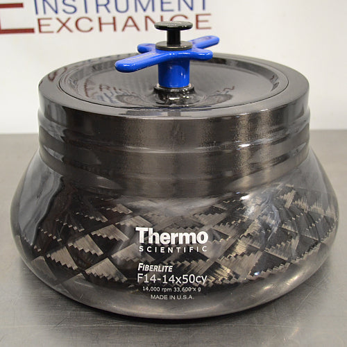 Front eye-level view of a Thermo Scientific Fiberlite F14-14x50cy carbon fiber centrifuge rotor, featuring a dark woven composite body, a secure lid, and a blue locking handle assembly