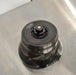 Top-down view of a Thermo Scientific Fiberlite F21-8x50cy carbon fiber centrifuge rotor resting on a stainless steel surface featuring a central locking lid mechanism