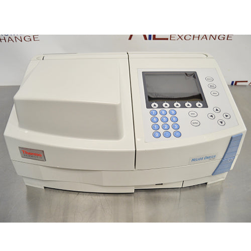Front product view of a Thermo Scientific Helios Omega UV-Vis spectrophotometer, featuring the sample compartment cover, integrated display screen, numerical keypad, and navigation controls on a metal lab counter