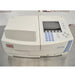 Front product view of a Thermo Scientific Helios Omega UV-Vis spectrophotometer, featuring the sample compartment cover, integrated display screen, numerical keypad, and navigation controls on a metal lab counter