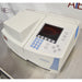 Right three-quarter angle product view of a Thermo Scientific Helios Omega UV-Vis spectrophotometer, showcasing the angled control panel, display screen, and sample compartment cover on a metal counter