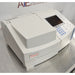 Three-quarter angle product view of a Thermo Scientific Helios Omega UV-Vis spectrophotometer, showcasing the sample compartment lid, integrated display, and control keypad on a stainless steel counter
