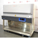 Low three-quarter perspective view of a Thermo Scientific Herasafe 2030i Class II Type A2 biosafety cabinet mounted on a wheeled base showing the open interior work surface and control panel