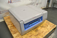 Front angled perspective view of a Thermo Scientific Megafuge ST4R Plus MD refrigerated centrifuge with its lid closed, resting on a wooden pallet and emphasizing the front control interface and side housing structure