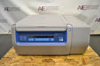 Front eye-level view of a Thermo Scientific Megafuge ST4R Plus MD refrigerated centrifuge with its lid closed, highlighting the main digital interface control panel, branded housing, and gray benchtop cabinet resting on a wooden pallet