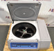 Top-down view of a Thermo Scientific Megafuge ST4R Plus MD refrigerated centrifuge with its lid open, revealing the internal rotor with four buckets, front digital control panel, and gray-and-white housing unit
