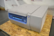 Right angled perspective view of a Thermo Scientific Megafuge ST4R Plus MD refrigerated centrifuge with its lid closed, resting on a wooden pallet and displaying the front control panel, side cooling vents, and smooth housing