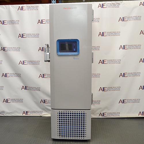 Studio front product view of a Thermo Scientific RLE30086D ultralow laboratory freezer against a branded backdrop, highlighting its tall white insulated cabinet, central door-mounted digital touchscreen interface with a blue bezel, handle mechanism on the left, and lower vented compressor grille