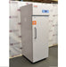 Left angled perspective view of Thermo Scientific TSFMS2305A flammable material storage refrigerator showing solid door, side casing, safety label, vertical handle, and top digital control console