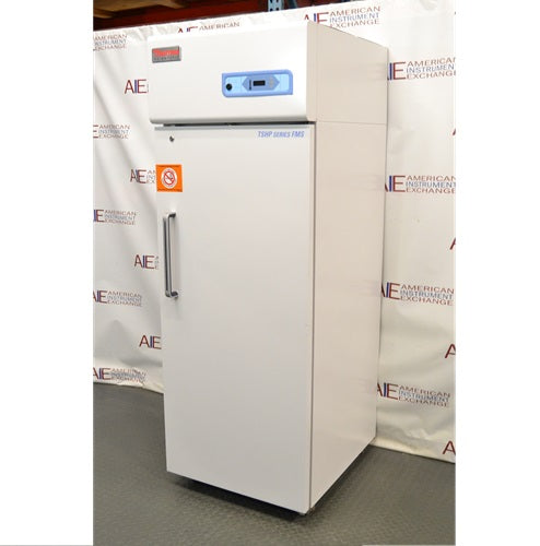 Right angled perspective view of Thermo Scientific TSFMS2305A flammable material storage refrigerator showing solid door, side paneling, vertical handle, and top digital control console