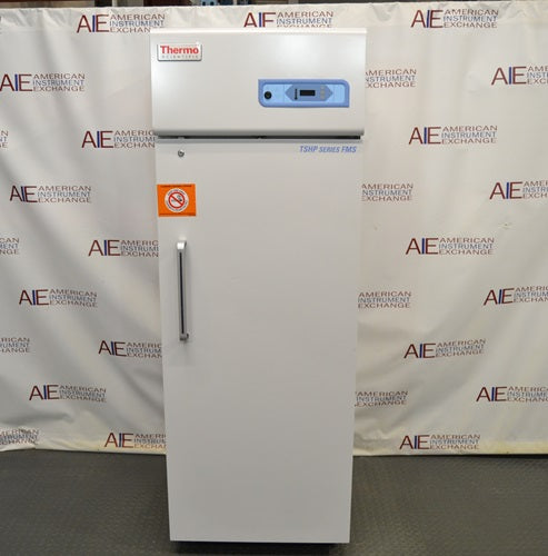 Front view of Thermo Scientific TSFMS2305A flammable material storage refrigerator featuring solid door, vertical handle, safety label, and top control console