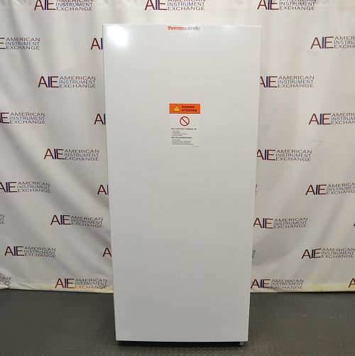 Front perspective view of white Thermo Scientific TSV20FPSA11 convertible refrigerator freezer with closed door showing front warning label