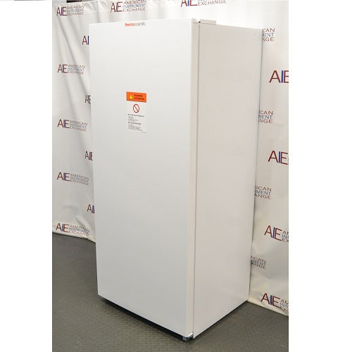 Right angled perspective view of white Thermo Scientific TSV20FPSA11 convertible refrigerator freezer with closed door showing front warning label
