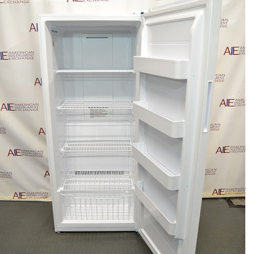 Front perspective view of white Thermo Scientific TSV20FPSA11 convertible refrigerator freezer with open door showing internal wire shelving, bottom wire basket, and door storage racks