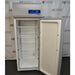 Front view of a Thermo Scientific TSX2320FD high-performance laboratory freezer with its door open, showcasing the white interior lining, multiple wire shelves, top control panel, and magnetic door gasket