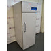 Front three-quarter product view of a Thermo Scientific TSX2320FD high-performance laboratory freezer, highlighting its grey upright cabinet, vertical door handle, keyed lock, and top control console