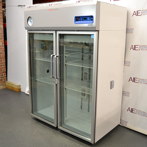 Right three-quarter angle product view of a Thermo Scientific TSX5005CA high-performance laboratory refrigerator, highlighting its right exterior side panel, dual glass doors, handles, and top-mounted digital interface
