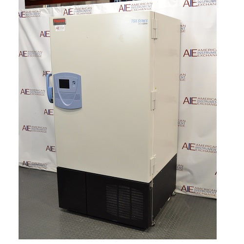 Angled perspective view of a Thermo Scientific TSX600D ultra-low temperature freezer showcasing its front door, blue control panel, and heavy-duty side hinge assembly