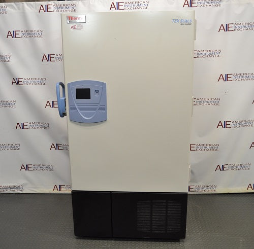 Front eye-level view of a Thermo Scientific TSX600D ultra-low temperature freezer featuring a full-length insulated door with a blue control display panel and handle