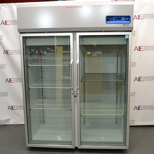 Thermo Scientific undercounter laboratory refrigerator ka open door view, jisme interior shelves, door storage compartment, aur clean white inner lining saaf dikhai de rahi hai.   