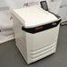 Thermo Sorvall Lynx 6000 superspeed refrigerated centrifuge ka left angle view, jisme left side external panel, touchscreen display, aur closed lid left angle se saaf dikhai de rahe hain.   