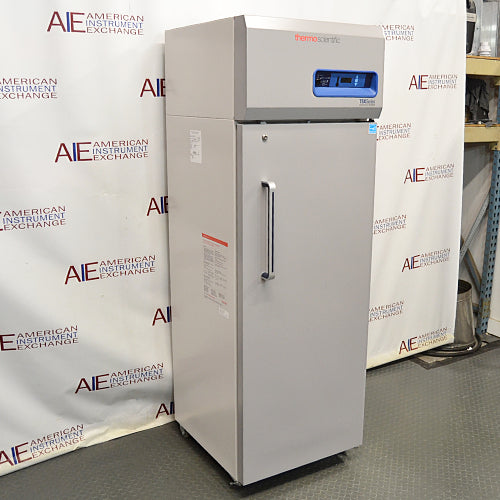 Front angled perspective view of a Thermo TSX1230FA high-performance -30C freezer, showcasing its light grey cabinet housing, tall solid locking door with a vertical handle, and top control console with digital display
