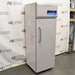 Front angled perspective view of a Thermo TSX1230FA high-performance -30C freezer, showcasing its light grey cabinet housing, tall solid locking door with a vertical handle, and top control console with digital display