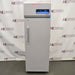 Front eye-level view of a Thermo TSX1230FA high-performance -30C freezer, featuring a light grey exterior body, a tall locking solid door with an ergonomic vertical handle, and a top-mounted control console with a digital display and Thermo Scientific branding