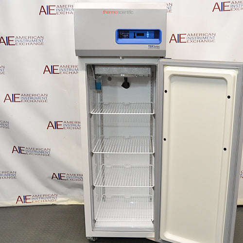 Front view of a Thermo TSX1230FA high-performance -30C freezer with its door open, revealing the interior wire shelves, cooling unit, and top control housing with a digital interface