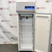 Front view of a Thermo TSX1230FA high-performance -30C freezer with its door open, revealing the interior wire shelves, cooling unit, and top control housing with a digital interface