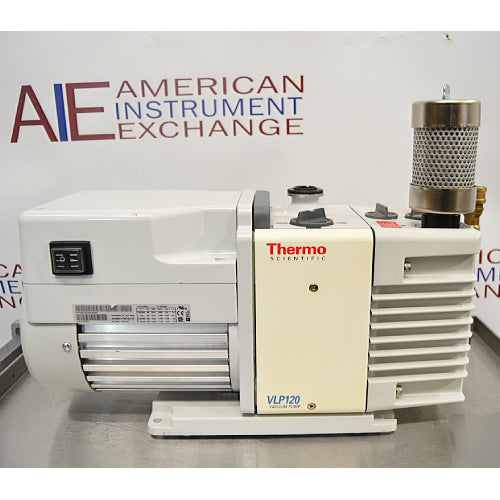 Side profile view of a Thermo Scientific VLP120 deep vacuum oil pump, showcasing its white housing, power switch, central pump unit, and vertical exhaust filter on a stainless steel bench