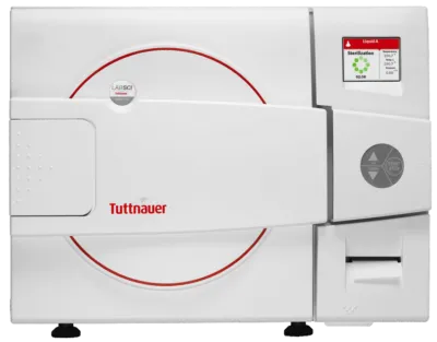 Front view of a Tuttnauer LabSci 11L benchtop autoclave with white casing, red ring graphics on the door, and a right-side digital display control panel