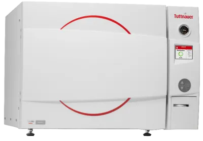 Tuttnauer LabSci 15+L benchtop autoclave with white casing, red circular accent graphics on the front door, and a right-side control panel featuring a touch screen, pressure gauge, and printer