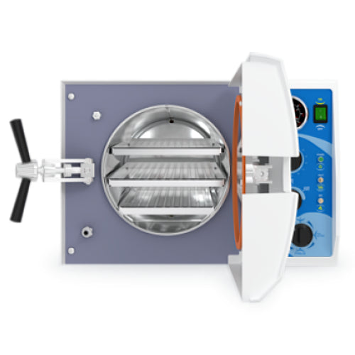 Front angle product view of a Tuttnauer MK-Series 2340MK 19L Manual KwiKlave autoclave with its front door swung open, revealing the orange rubber gasket, stainless steel inner chamber, and loaded internal wire instrument racks