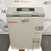 Front product view of a Tuttnauer T-Lab Eco V60 60L vertical laboratory autoclave, featuring its beige cabinet enclosure, grey top console with digital touchscreen interface, safety latch, pressure gauge, and lower water reservoir