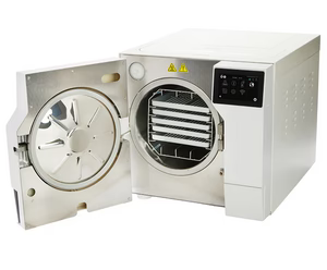Three-quarter perspective view of a white Tuttnauer T-Top 11B tabletop autoclave with its front door swung open, revealing the stainless steel sterilization chamber and internal tray rack system