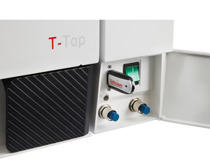 Close-up view of the lower front compartment of a Tuttnauer T-Top 11B autoclave with open access door, showing a Tuttnauer USB flash drive inserted, power rocker switch, and quick-connect water ports