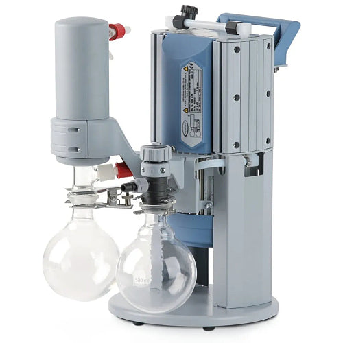 Front three-quarter product view of a Vacuubrand MD 1C +AK +EK chemistry diaphragm vacuum pump, highlighting its vertical grey housing, emission condenser, dual glass collection flasks, and valve setup