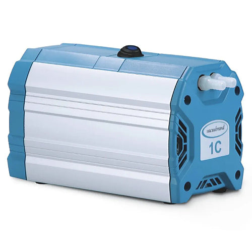 Front three-quarter product view of a Vacuubrand ME 1C chemistry diaphragm vacuum pump, highlighting its elongated silver and blue housing, top power switch, and front port connections