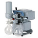 Front three-quarter product view of a Vacuubrand MZ 2C NT +AK Synchro+EK chemistry diaphragm vacuum pump, highlighting its grey housing, dual glass collection flasks, and integrated valves