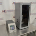 Angled perspective view of Sonics Vibra-Cell VCX 500 ultrasonic processor control unit standing beside a tall sound-abating enclosure housing the converter assembly