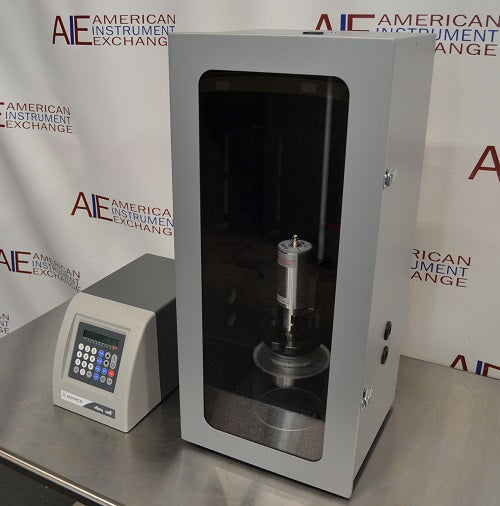 Right angled perspective view of Sonics Vibra-Cell VCX 500 ultrasonic processor control unit next to sound-abating enclosure containing converter and probe setup