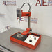 Left three-quarter angle product view of a Virtis Model 23 micro homogenizer, featuring its red and chrome motor drive assembly, vertical support column, base platform with control console, and glass mixing container on a stainless steel bench