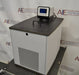Left angled perspective view of VWR model 89203-010 heated and refrigerated circulating bath displaying main body, front ventilation grille, bath lid with handle, and top digital controller unit